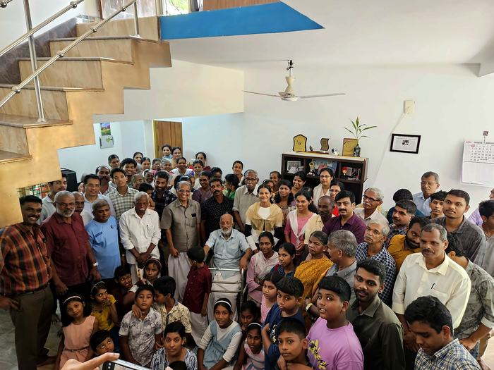 Surrounded by members of the church at Pothanicad